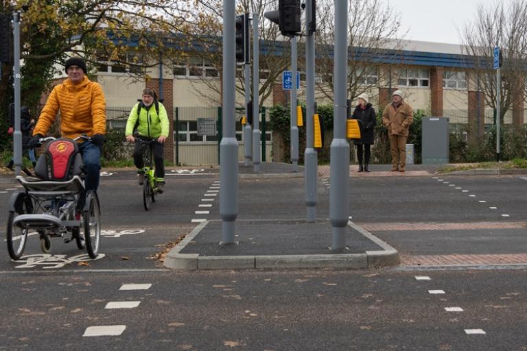 People crossing the road at Elmleigh Road SPARROW crossing.