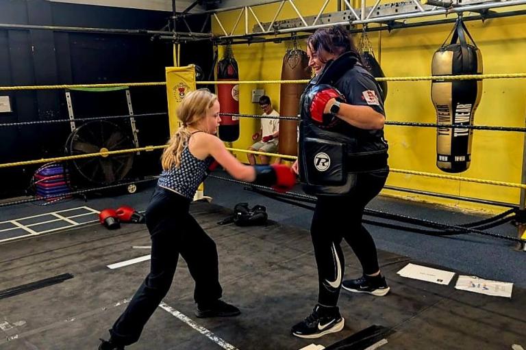 Mother and daughter boxing