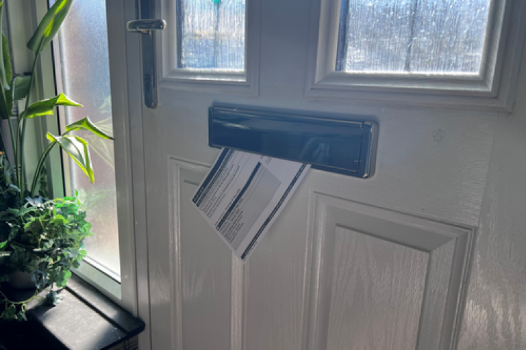 poll card through letter box