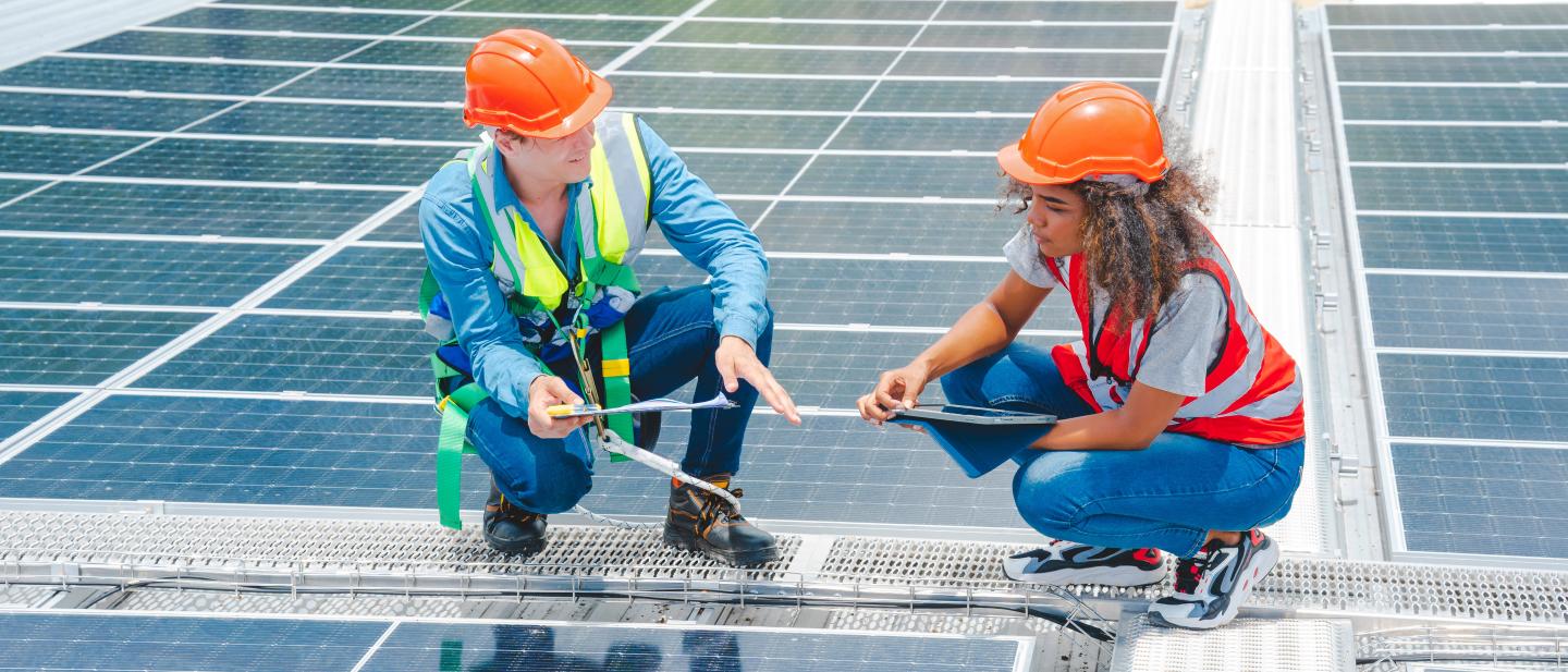 Person being trained to install solar panels.