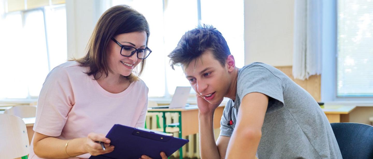 woman speaking to young person