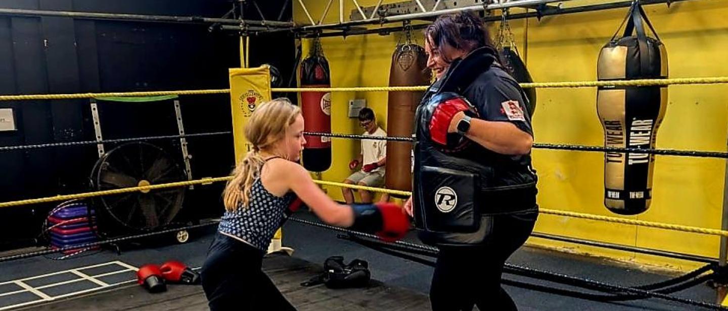 Mother and daughter boxing